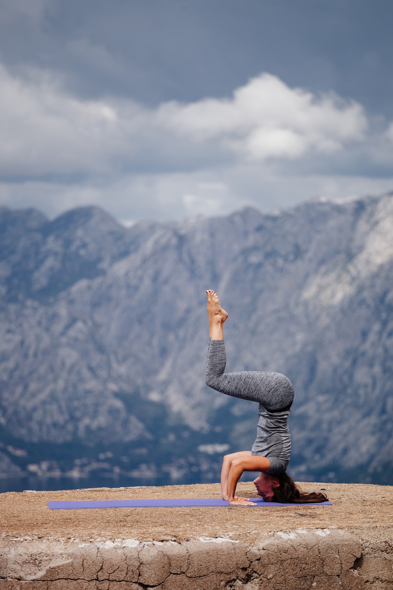 woman yoga and stretching in mountains